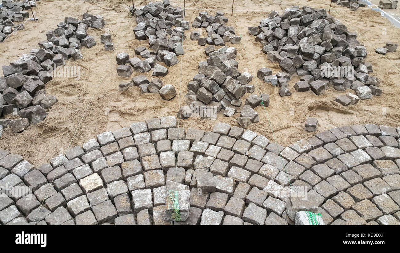 Construction of a paved road in an old city with historical atmosphere. Stock Photo