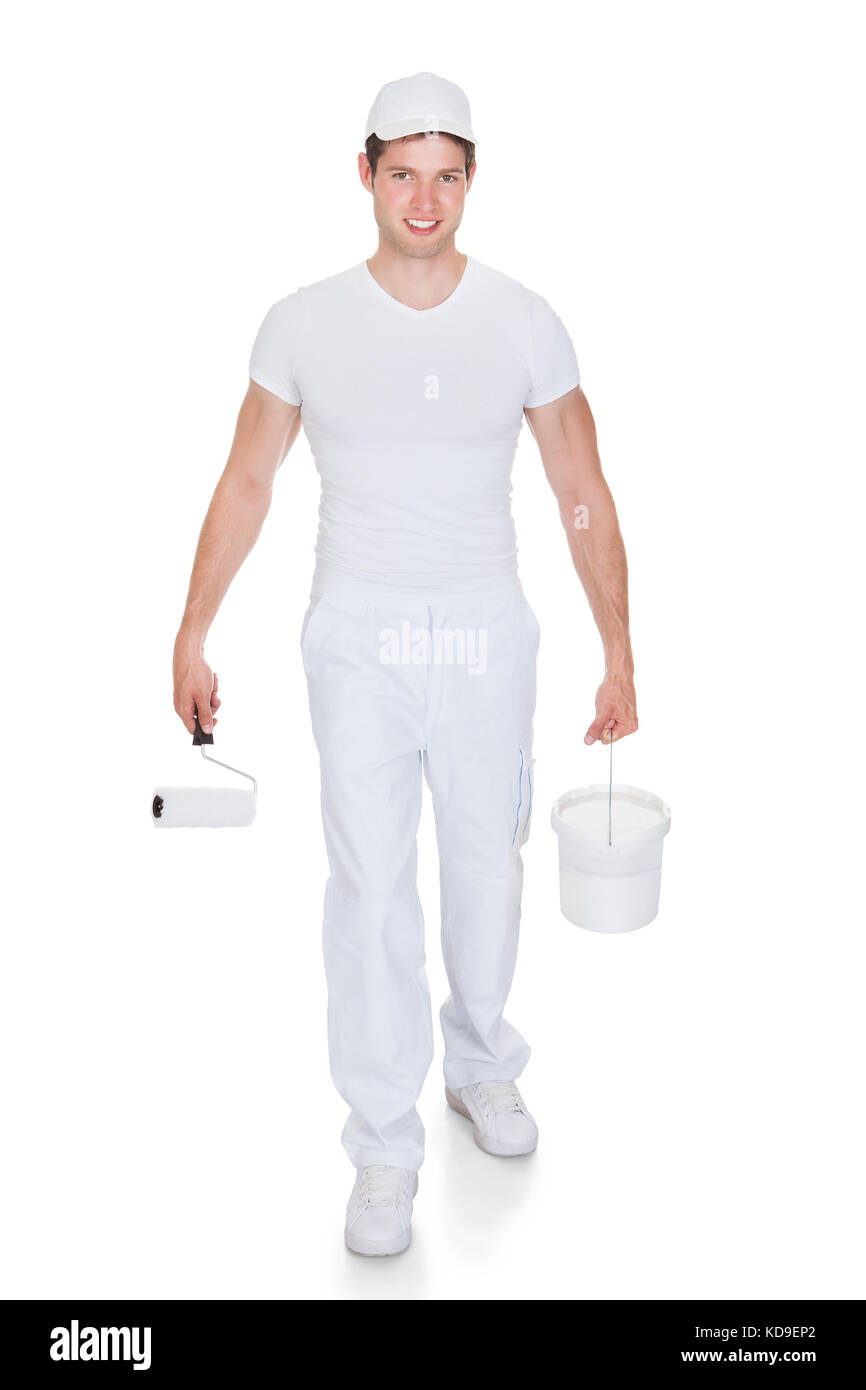 Portrait Of A Painter Holding Paint Roller And Bucket Stock Photo