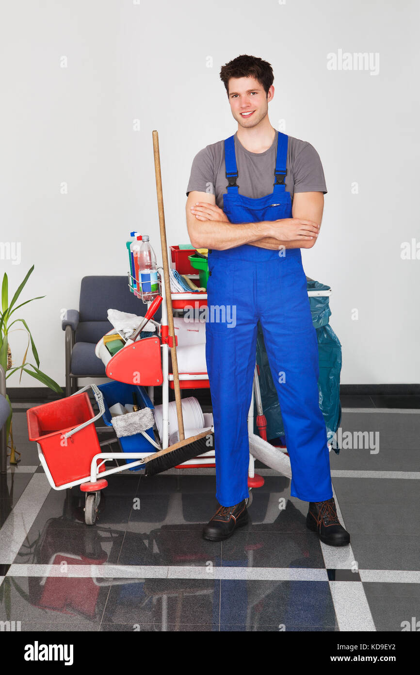 Young man standing front wall hi-res stock photography and images - Alamy