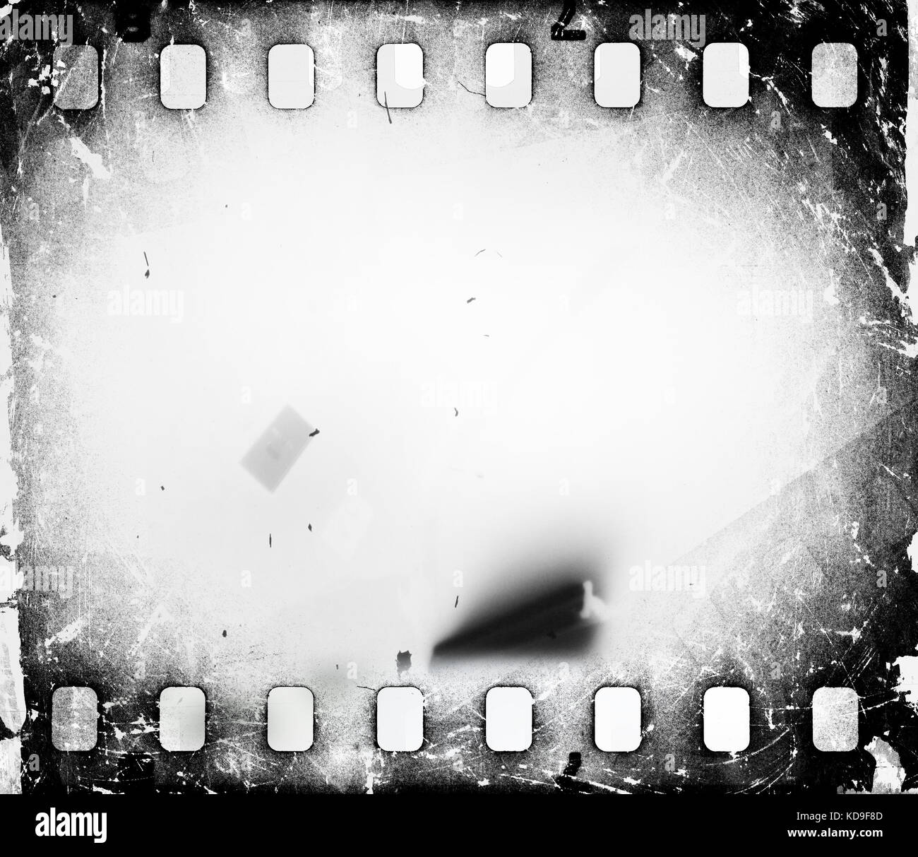 Grunge scratched dirty film strip background with blurred effect. Stock Photo
