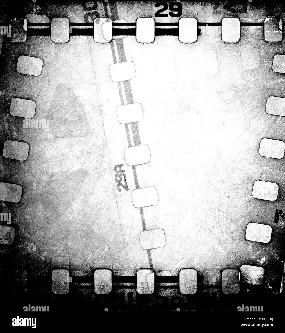 Grunge scratched dirty film strip background with reel. Stock Photo