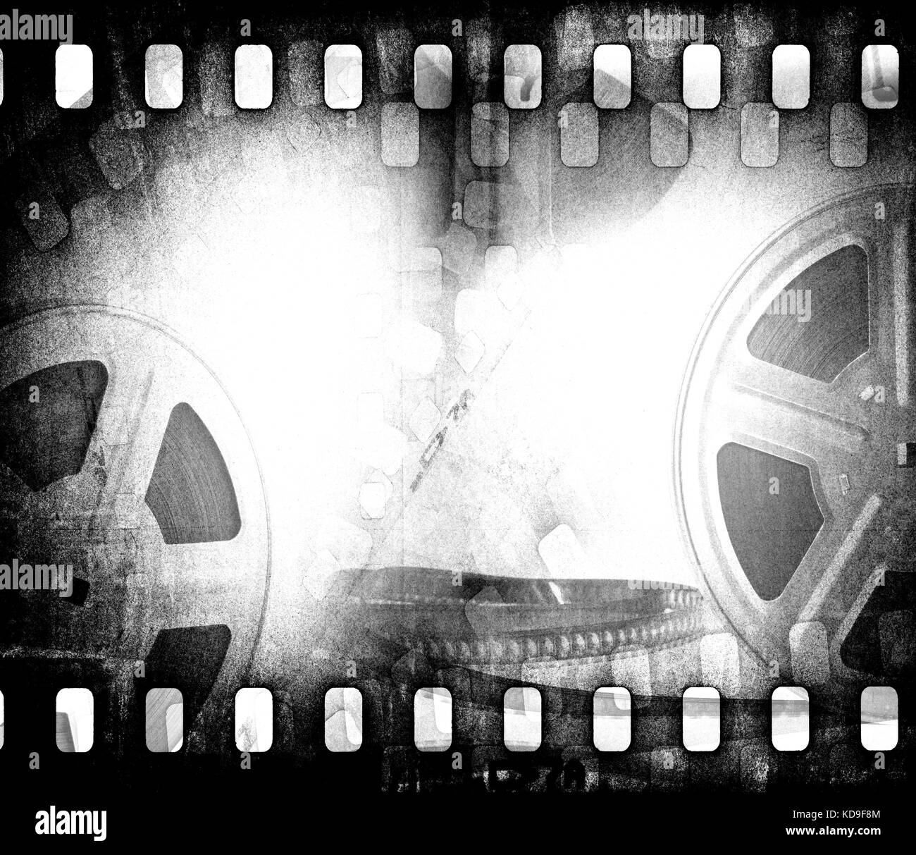 Grunge scratched dirty film strip background with reel. Stock Photo
