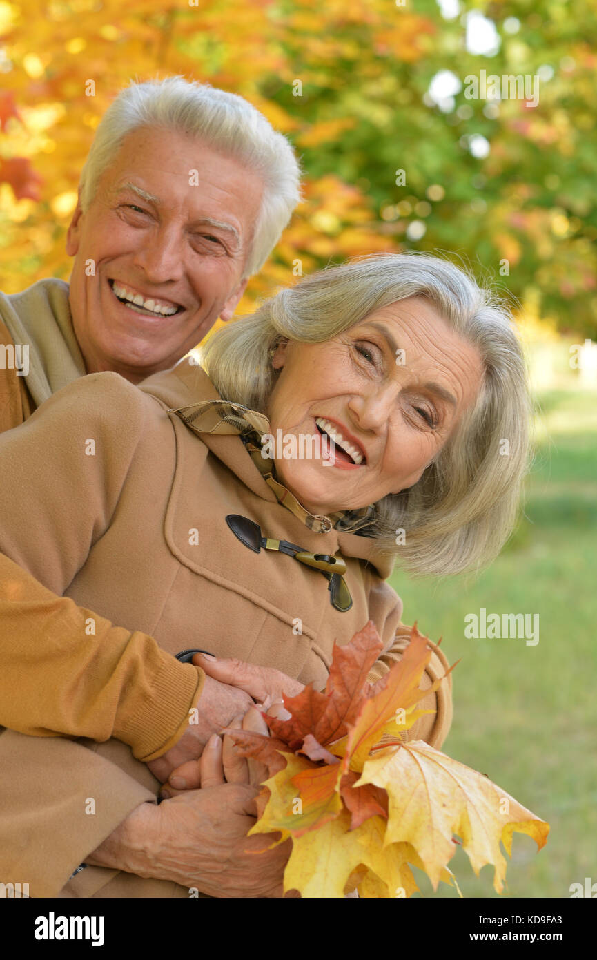 senior couple hugging in the park Stock Photo - Alamy