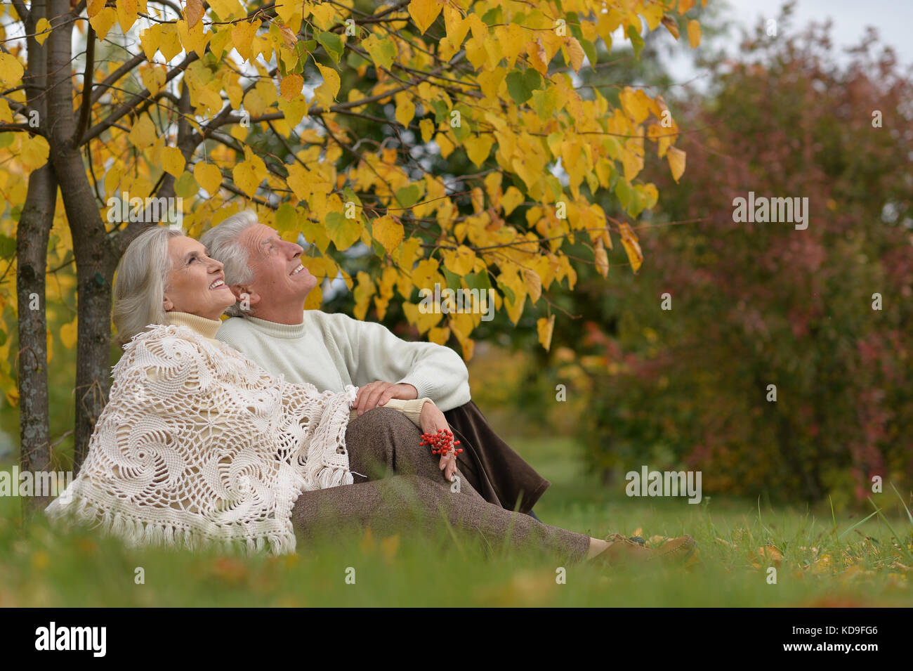 Senior couple sitting Stock Photo - Alamy