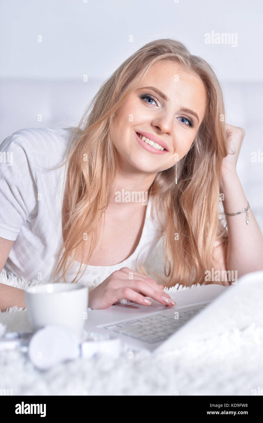 young woman using laptop Stock Photo - Alamy