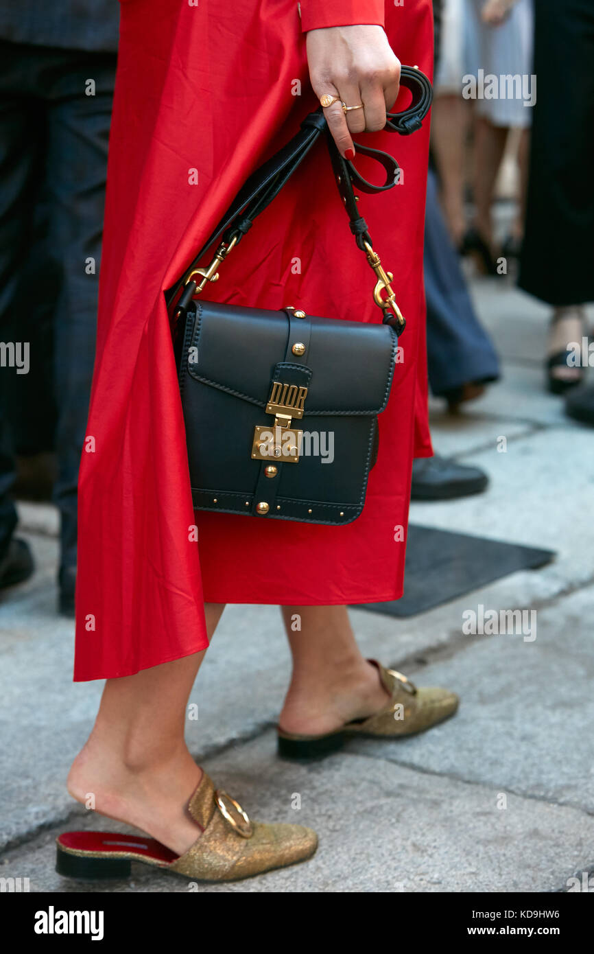 MILAN - SEPTEMBER 21: Woman with red dress, golden shoes and Dior bag  before Max Mara fashion show, Milan Fashion Week street style on September  21, 2 Stock Photo - Alamy