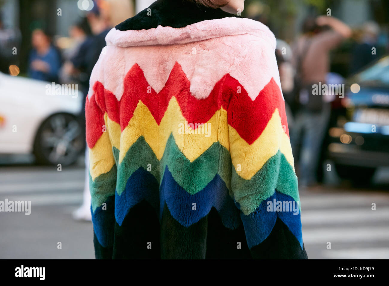 MILAN - SEPTEMBER 21: Woman with fur coat with geometric design in pink,  red, yellow, green, blue and black colors before Prada fashion show, Milan  Fa Stock Photo - Alamy