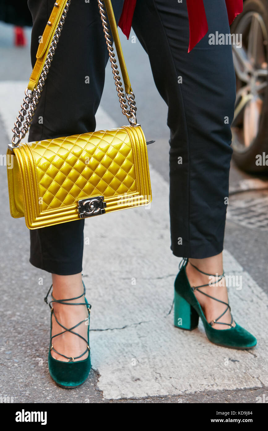 MILAN - SEPTEMBER 21: Woman with Prada velvet bag in green, blue and yellow  colors before Prada fashion show, Milan Fashion Week street style on Septe  Stock Photo - Alamy