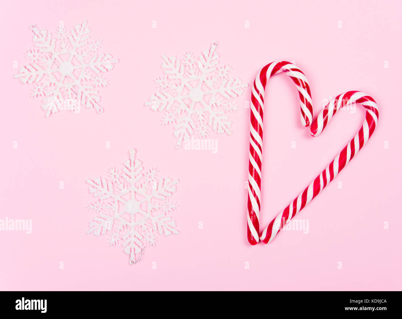 Christmas candy on pink background Stock Photo - Alamy