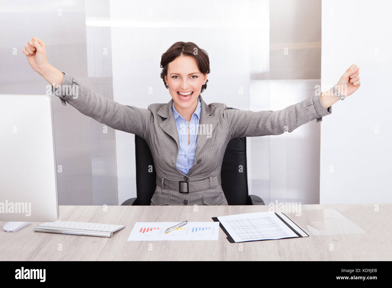 Successful Excited Young Businesswoman With Hand Extended Stock Photo