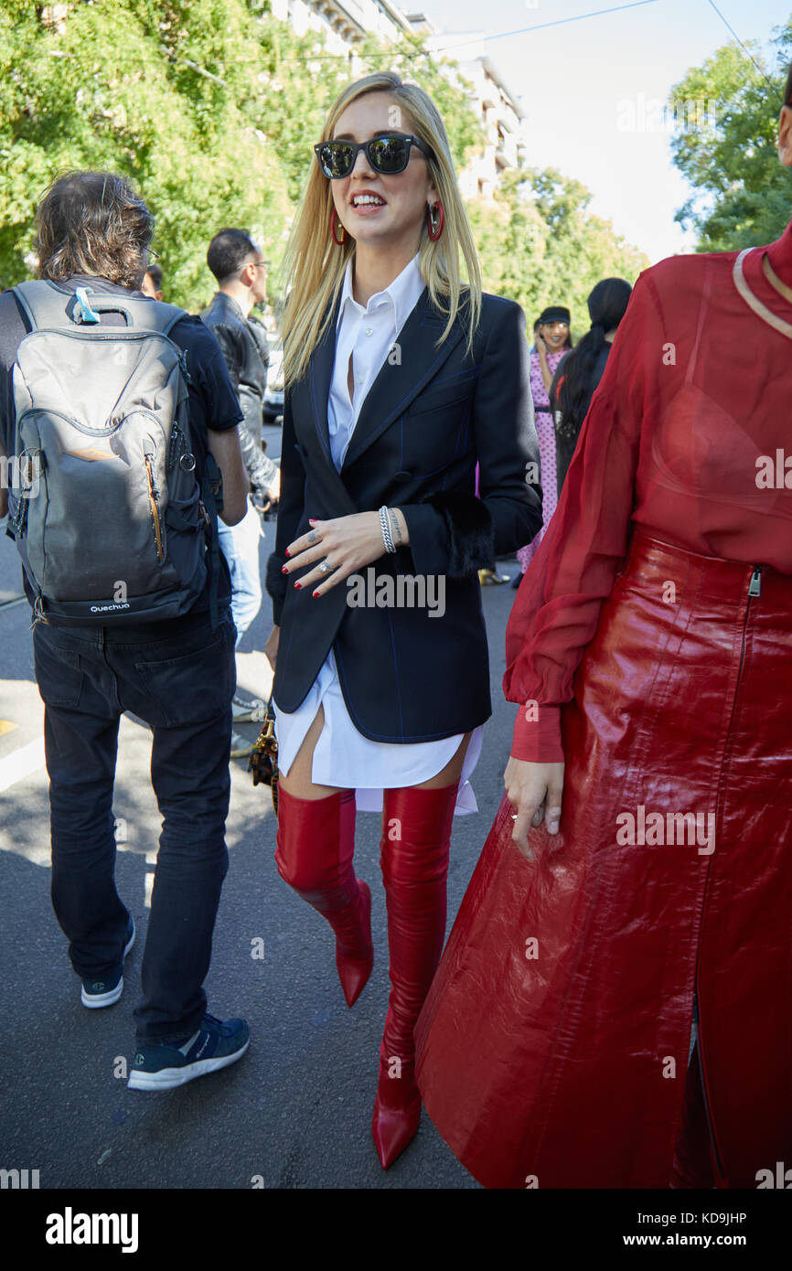 MILAN - SEPTEMBER 21: Chiara Ferragni with red leather boots, black jacket  and white shirt walking before Fendi fashion show, Milan Fashion Week stree  Stock Photo - Alamy