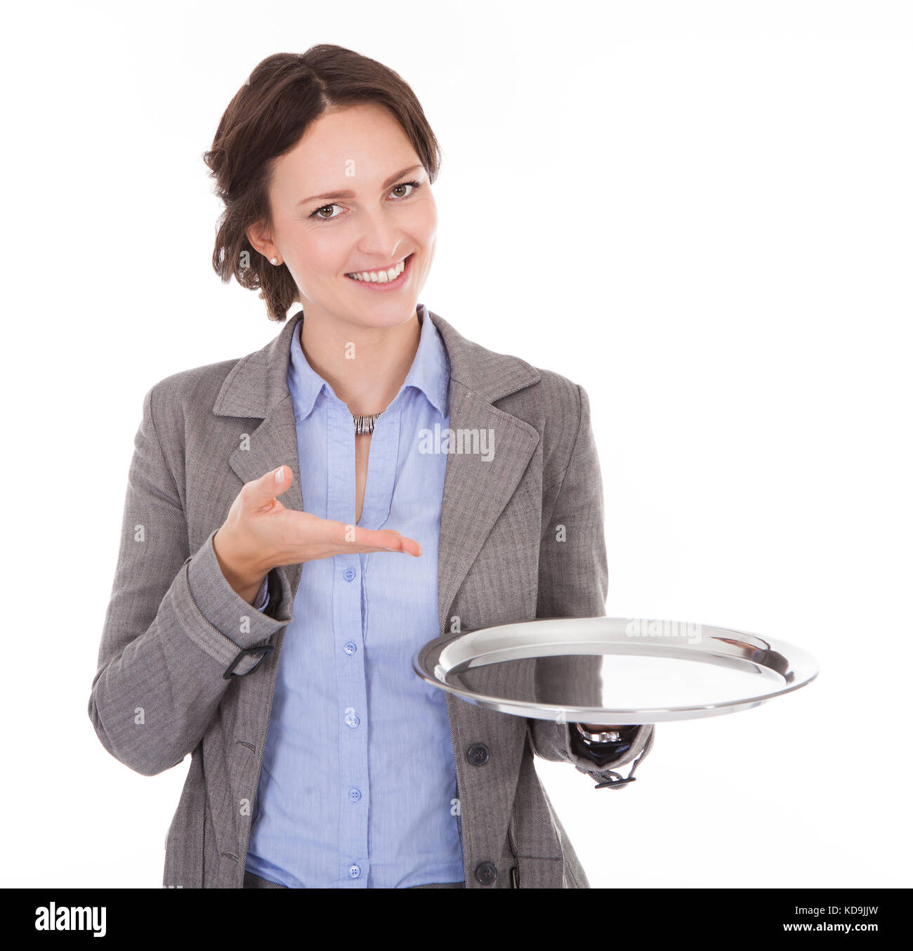 Smiling Businesswoman Holding Empty Plate On White Background Stock Photo