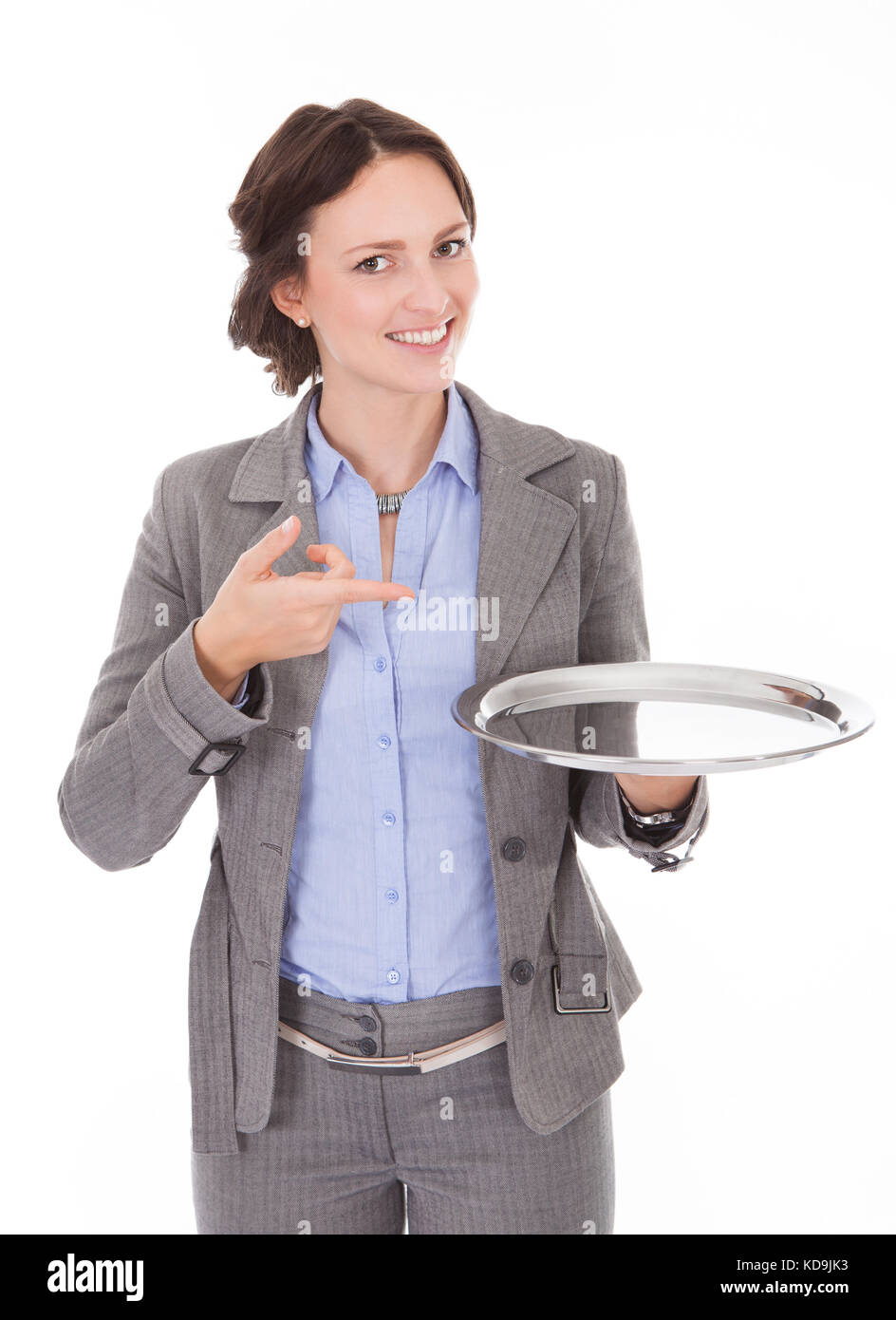 Smiling Businesswoman Holding Empty Plate On White Background Stock Photo