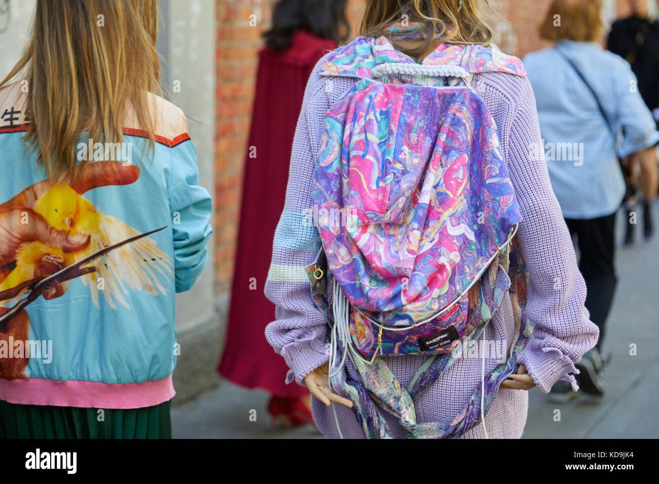 MILAN - SEPTEMBER 21: Woman with Eastpak artist studio purple backpack  abstract design before Fendi fashion show, Milan Fashion Week street style  on S Stock Photo - Alamy