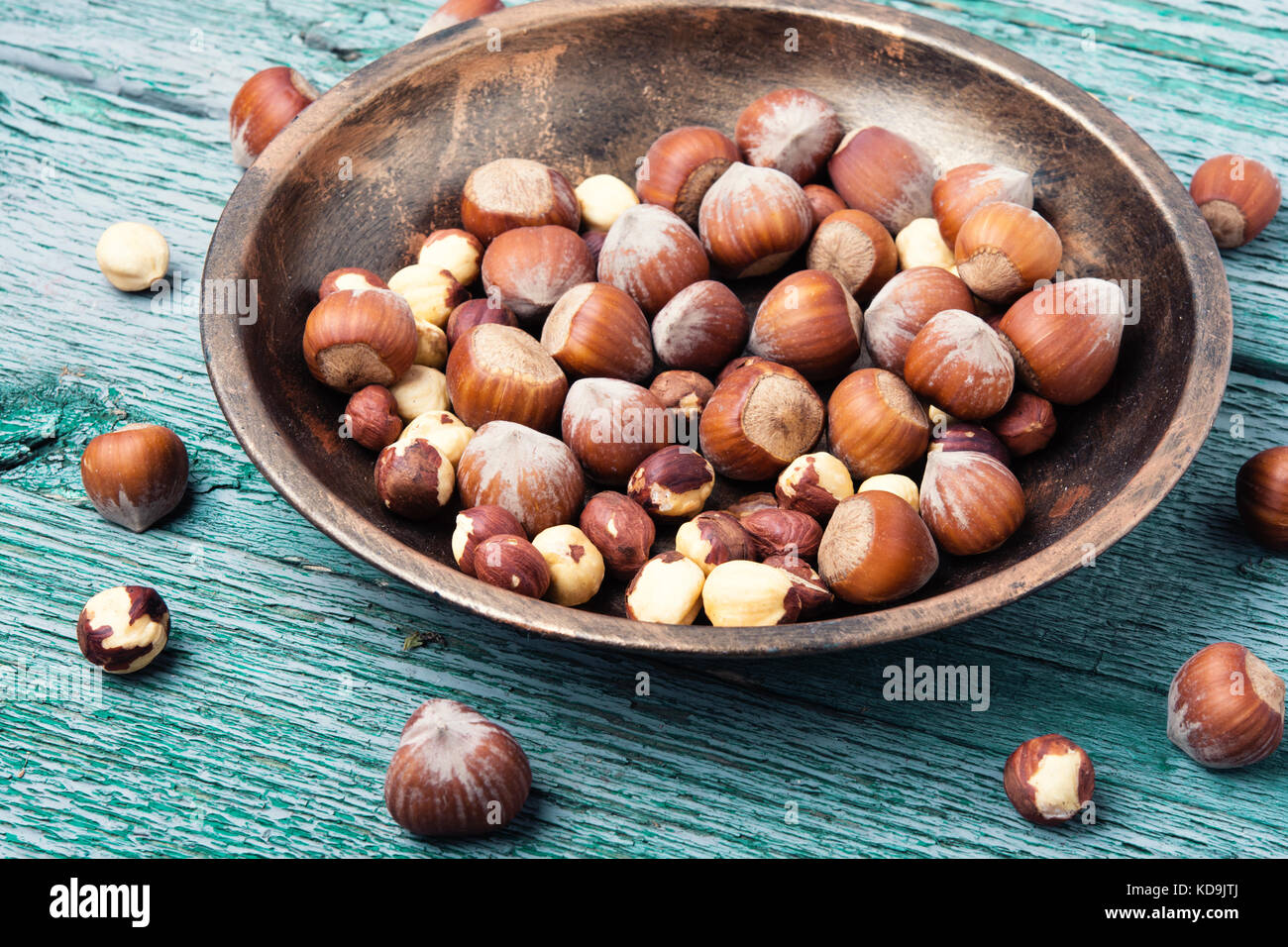 nut hazelnuts in the shell and chipped in a bowl Stock Photo Alamy