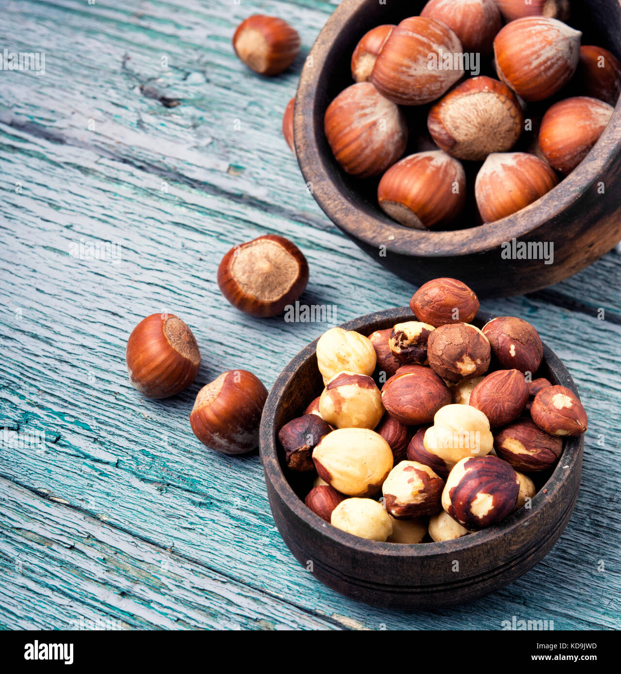 nut hazelnuts in the shell and chipped in a bowl Stock Photo Alamy