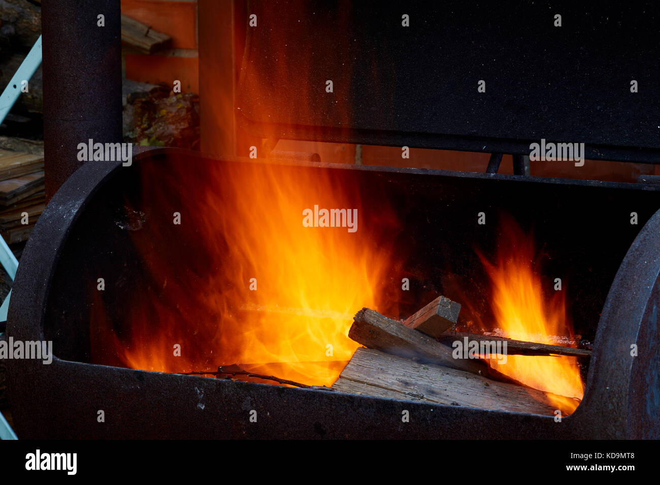 Burning firewood in the barbecue at backyard close up Stock Photo Alamy