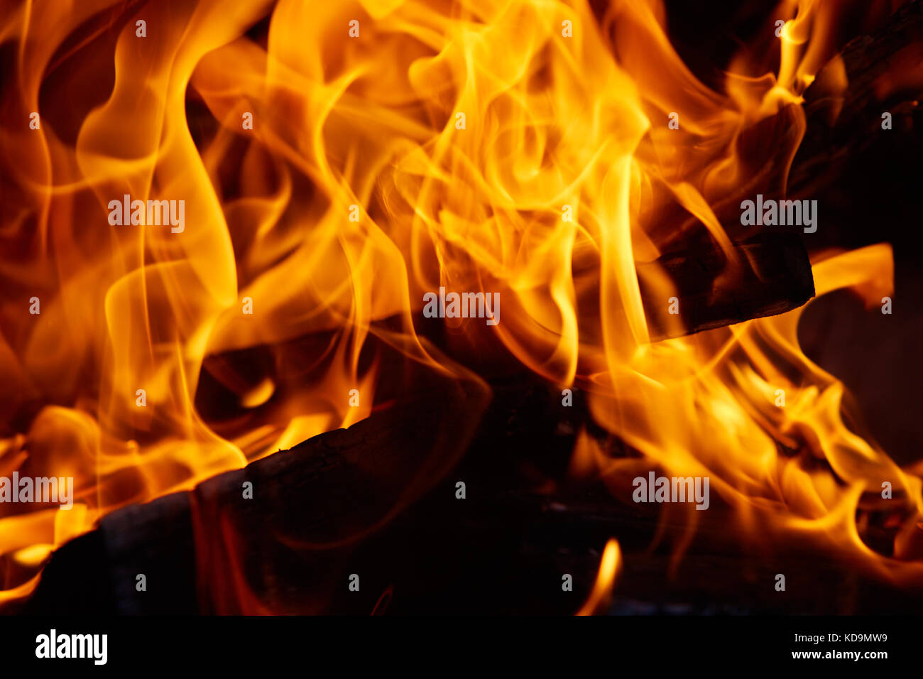 Burning firewood in the fireplace close up photo Stock Photo - Alamy