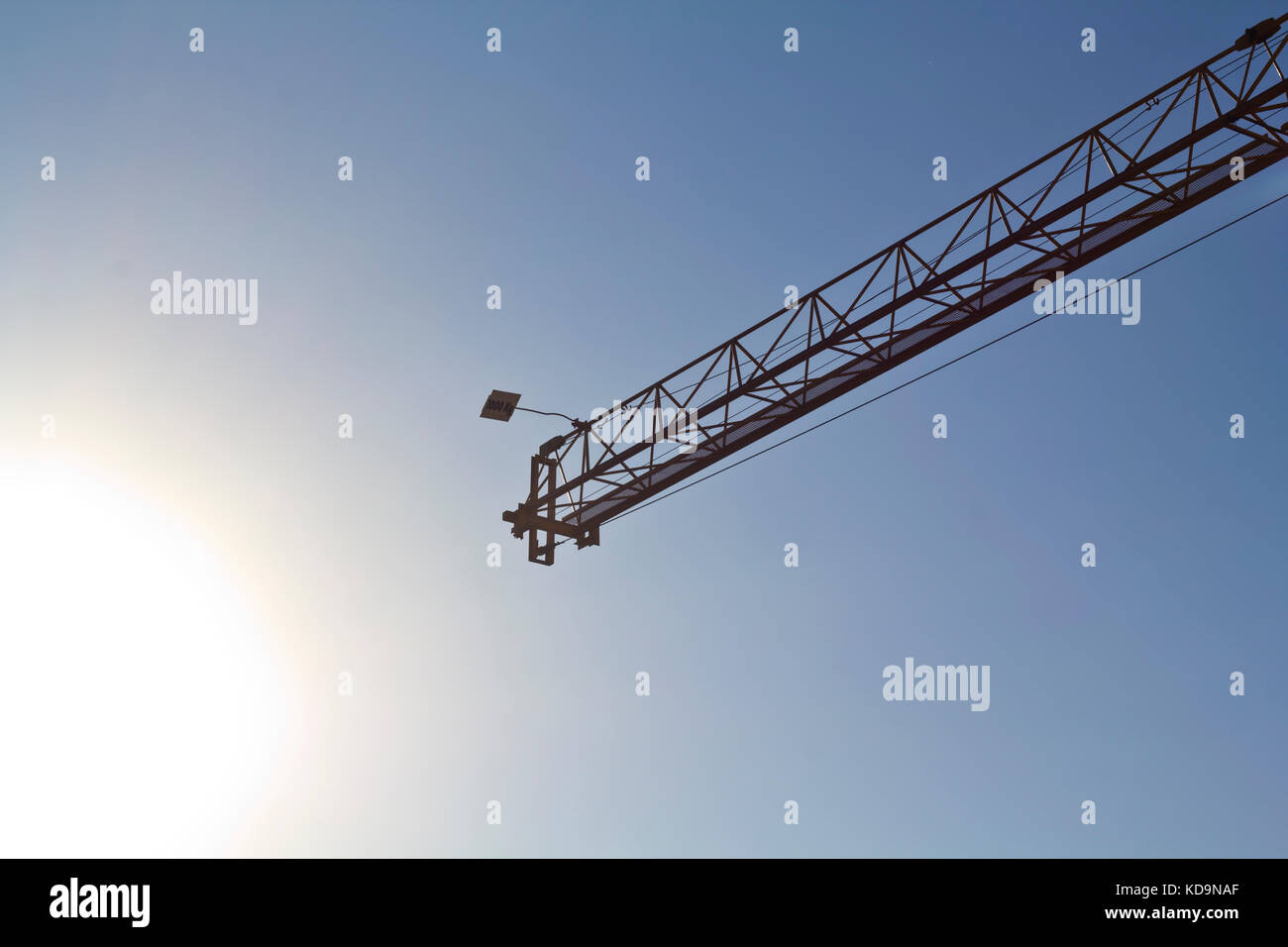 Crane against blue sky Stock Photo - Alamy