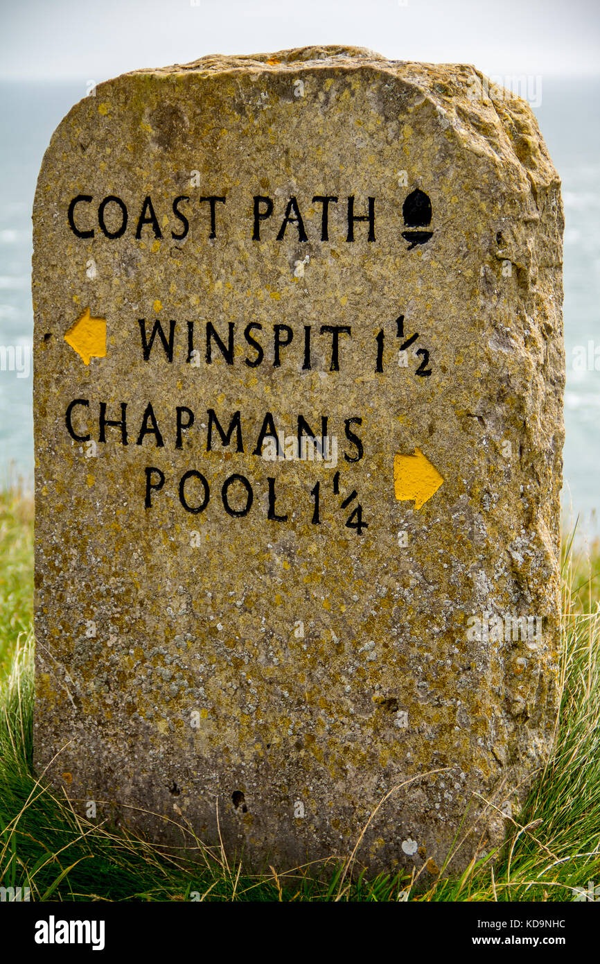 Mile Stone near Worth Matravers in Dorset, marking directions and distance to Winspit and Chapmans Pool Stock Photo