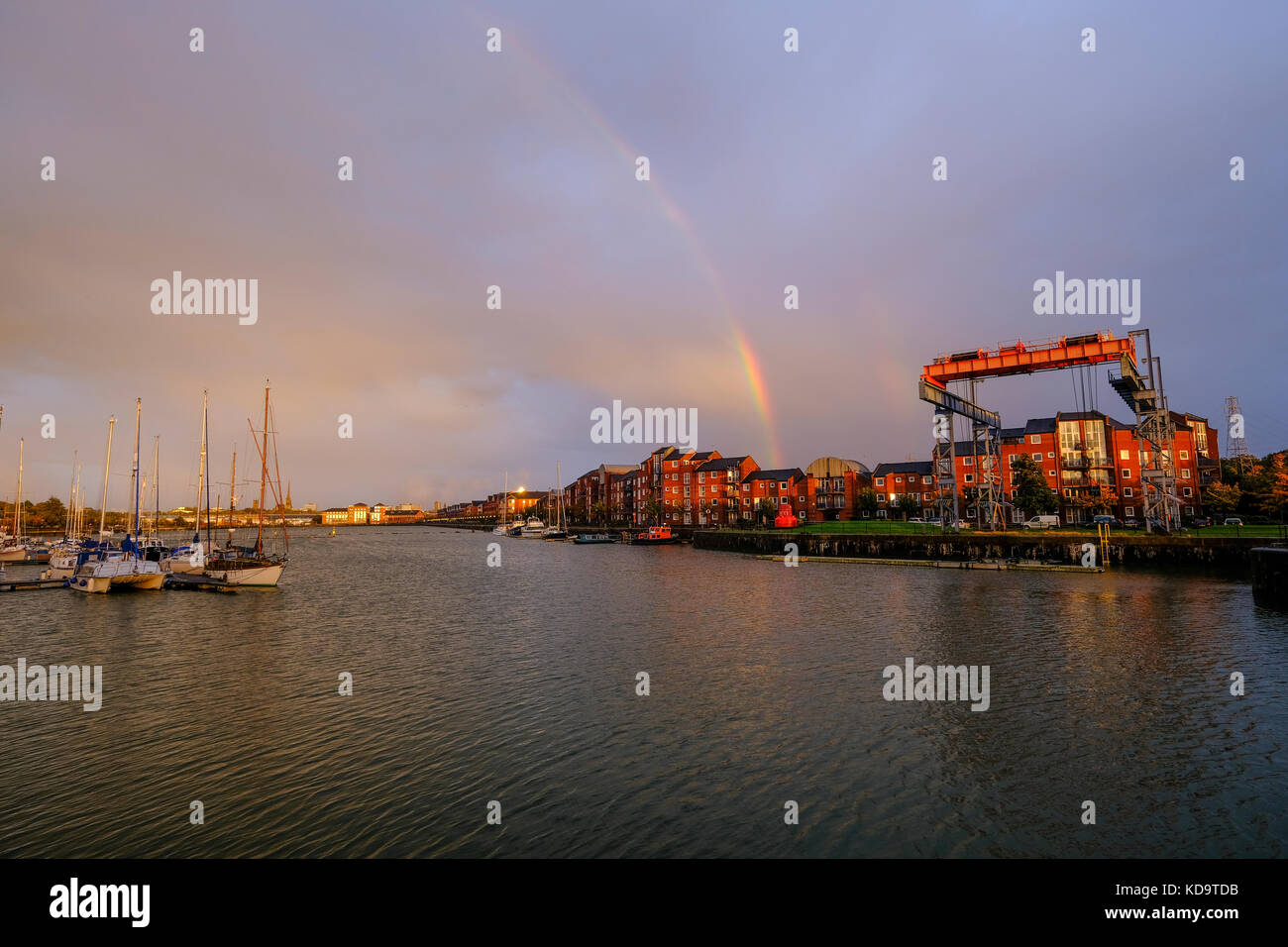 Preston, UK. 11th October 2017. UK Weather. After a wet day in Lancashire, the sun appeared briefly before sunset, creating a rainbow over Preston's Albert Dock.  The dock celbrated its 125th birthday this year and when built was the largest single dock in Europe. Credit: Paul Melling/Alamy Live News Stock Photo