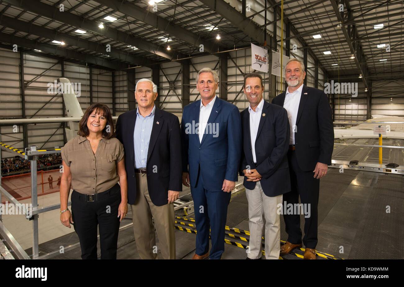 U.S. Vice President Mike Pence, Karen Pence and House Majority Leader Kevin McCarthy, center, and Rep. David Valadao pose with Stratolaunch CEO Jean Floyd, right, during a tour of the Mojave Air and Space Port October 10, 2017 in Mojave, California.  (Stratolaunch Systems Corp via Planetpix) Stock Photo