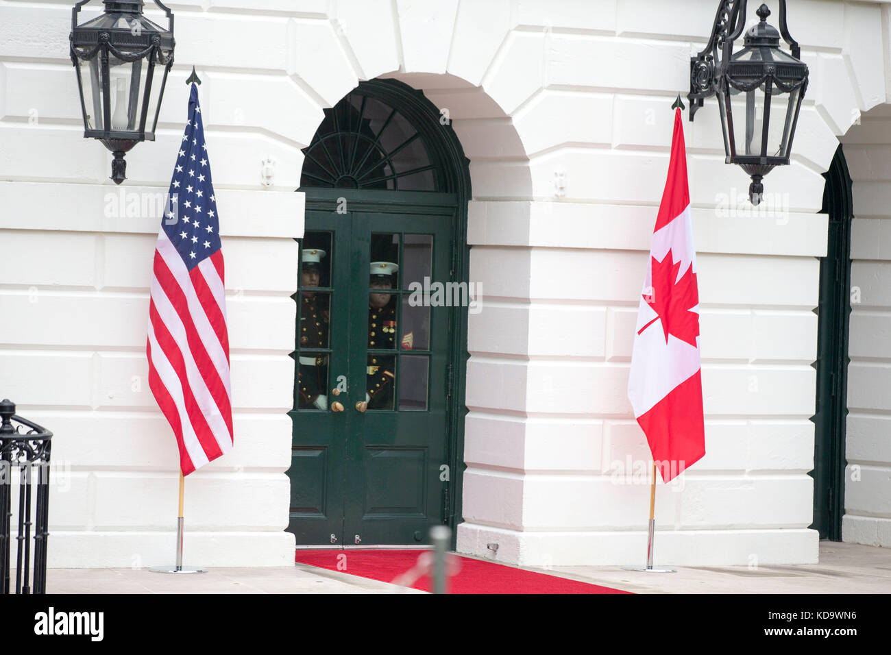 Washington DC, USA. 11th Oct, 2017. Two United States Marines peer through the doors of the South portico of the White House prior to the arrival of the Prime Minister of Canada Justin Trudeau and his wife Sophie Grégoire at the White House on October 11th, 2017 in Washington, DC Credit: Alex Edelman/CNP /MediaPunch Credit: MediaPunch Inc/Alamy Live News Stock Photo