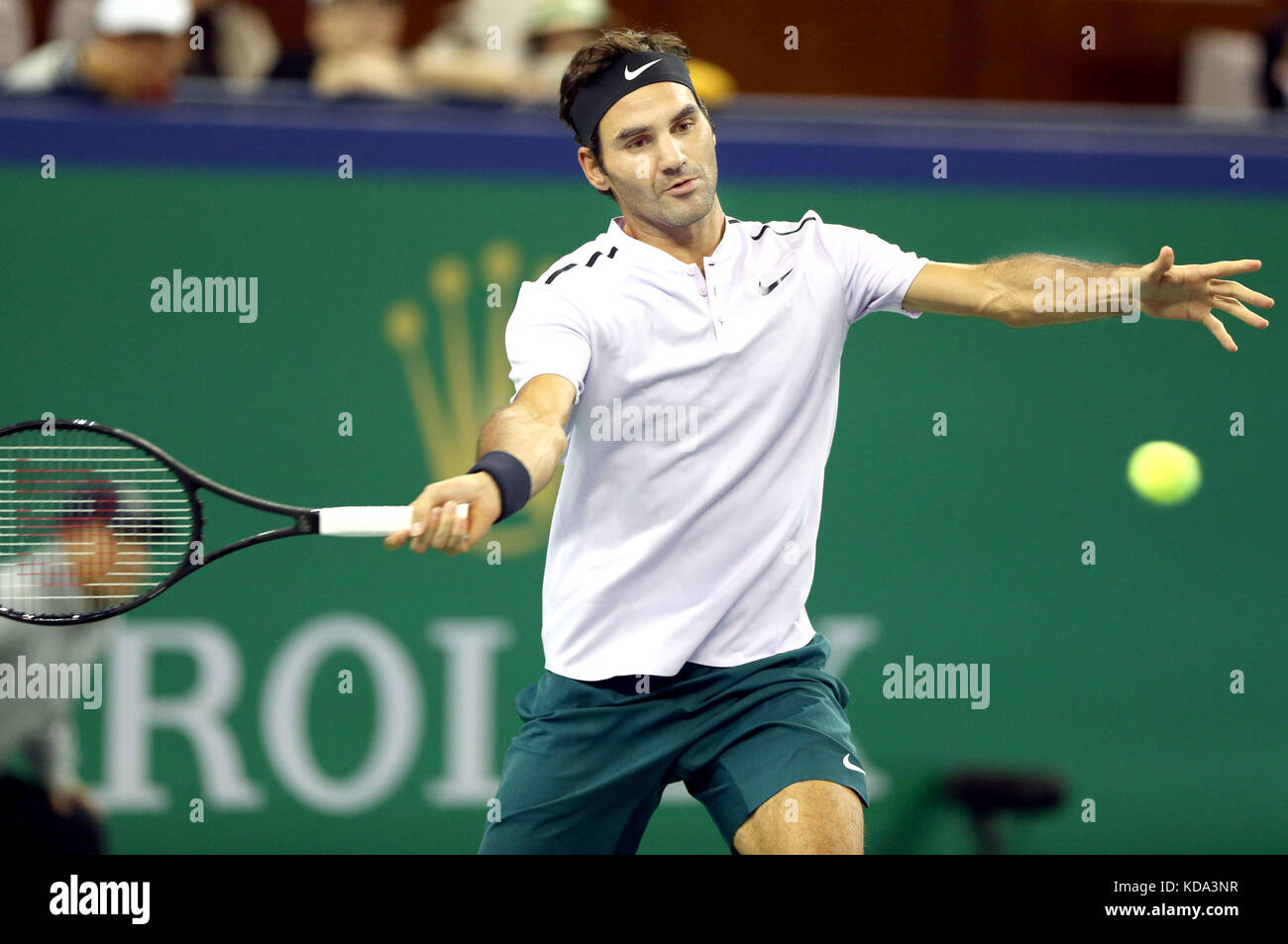 Shanghai, China. 12th Oct, 2017. Roger Federer of Switzerland hits a return during the singles third round match against Alexandr Dolgopolov of Ukraine at 2017 ATP Shanghai Masters tennis tournament in Shanghai, east China, on Oct. 12, 2017. Credit: Fan Jun/Xinhua/Alamy Live News Stock Photo