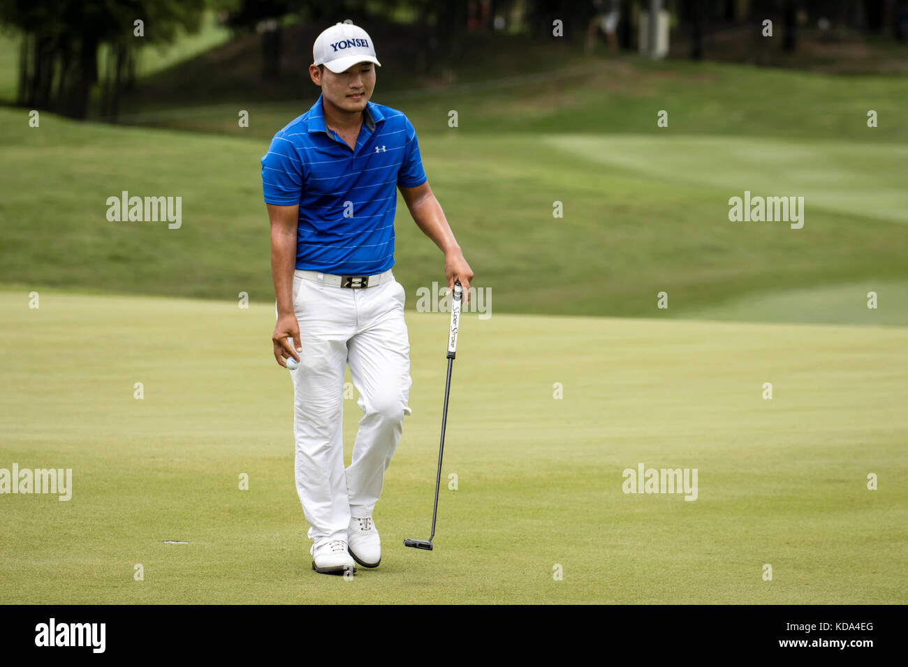 Kuala Lumpur, Malaysia. 12th Oct, 2017. Korean Sung Kang sink his shot on the 5th hole green at the PGA CIMB Classic 2017 golf tournament in Kuala Lumpur, Malaysia. Credit: Danny Chan/Alamy Live News Stock Photo