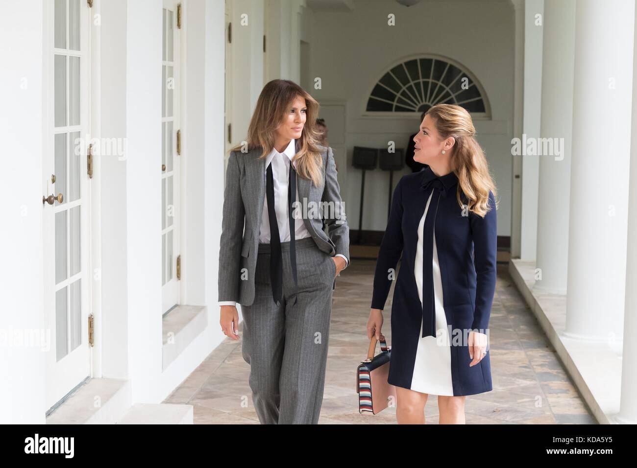 Washington, United States Of America. 11th Oct, 2017. U.S. First Lady Melania Trump, left, walks with the First Lady of Canada Sophie Grégoire Trudeau through the White House Colonnade October 11, 2017 in Washington, DC. Credit: Planetpix/Alamy Live News Stock Photo