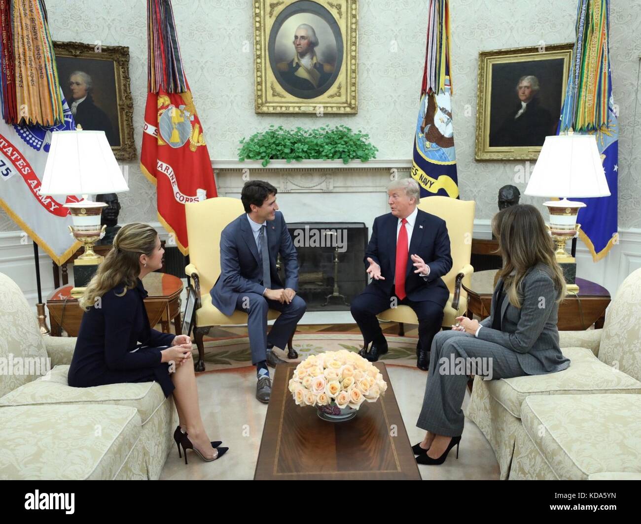 Washington, United States Of America. 11th Oct, 2017. U.S. President Donald Trump and First Lady Melania Trump during a meeting with Canadian Prime Minister Justin Trudeau and his wife Sophie Grégoire Trudeau, left, in the Oval Office of the White House October 11, 2017 in Washington, DC. Credit: Planetpix/Alamy Live News Stock Photo