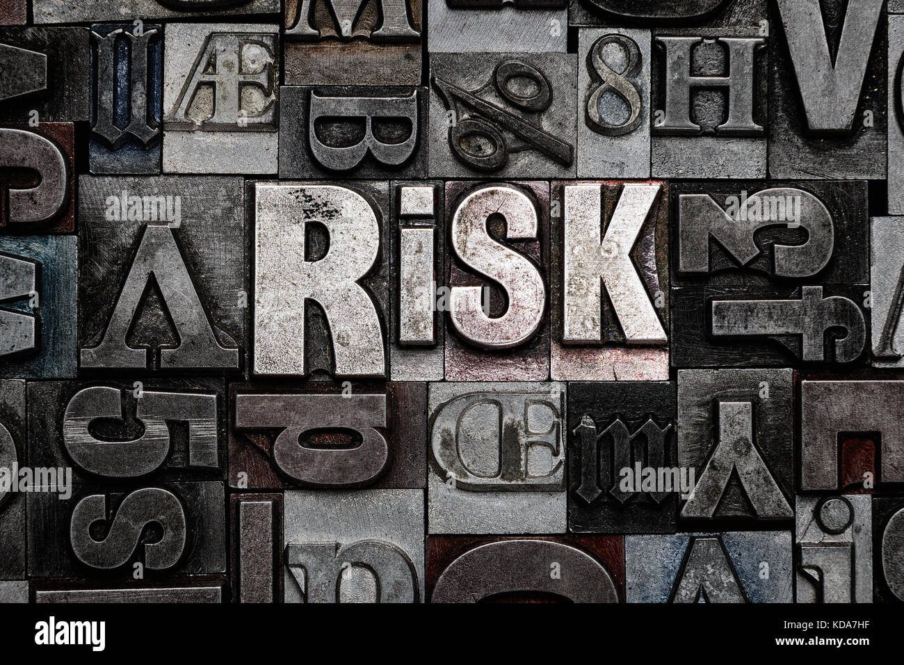 The word Risk made from old metal letterpress letters Stock Photo