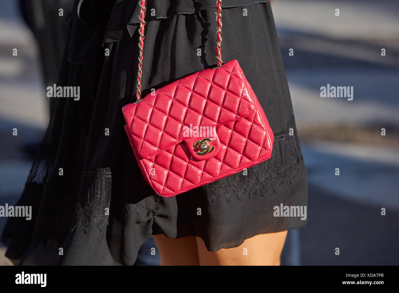 MILAN - SEPTEMBER 20: Woman with red leather Chanel bag and black dress  before Alberta Ferretti fashion show, Milan Fashion Week street style on  Septe Stock Photo - Alamy