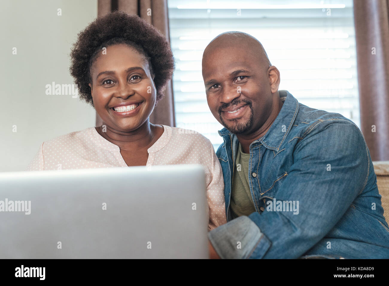 Loving black couple laptop hi-res stock photography and images - Alamy