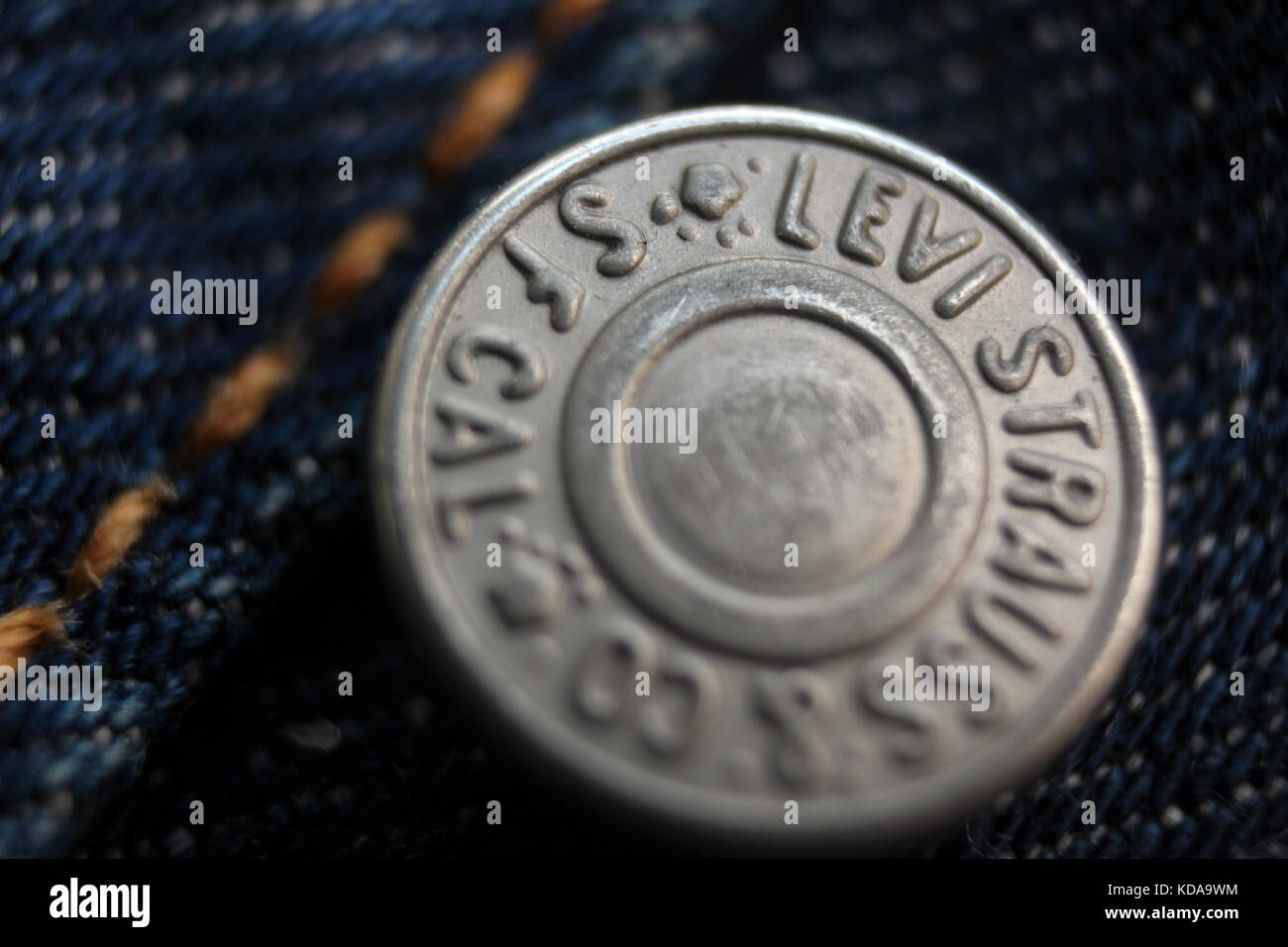 Closeup of button reading "Levi Strauss & Co SF Cal" on a pair of