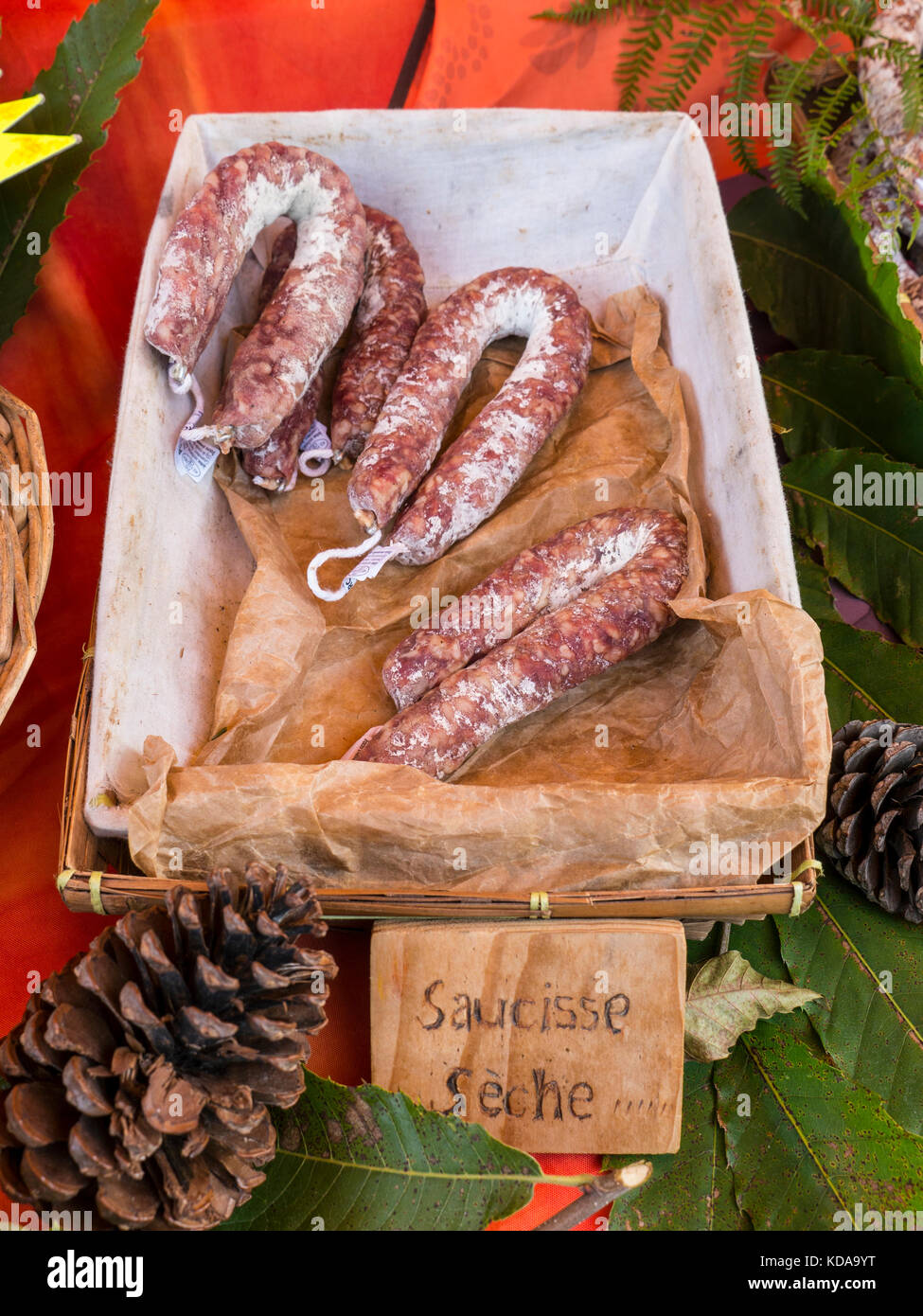 https://c8.alamy.com/comp/KDA9YT/french-saucisse-dry-sausage-attractively-displayed-on-rustic-country-KDA9YT.jpg