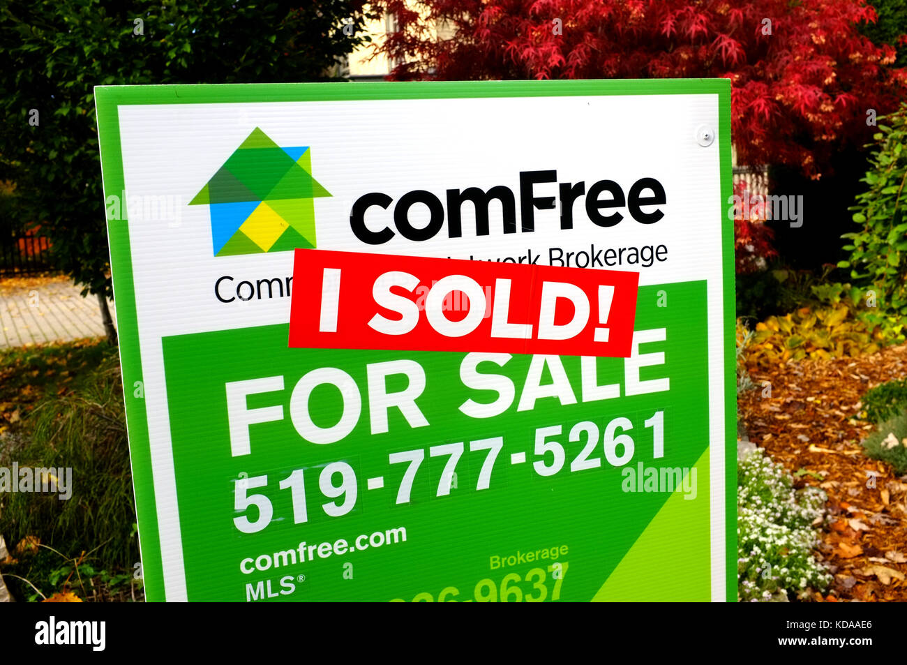 A sold sticker over a for sale sign in London, Ontario in Canada. Stock Photo