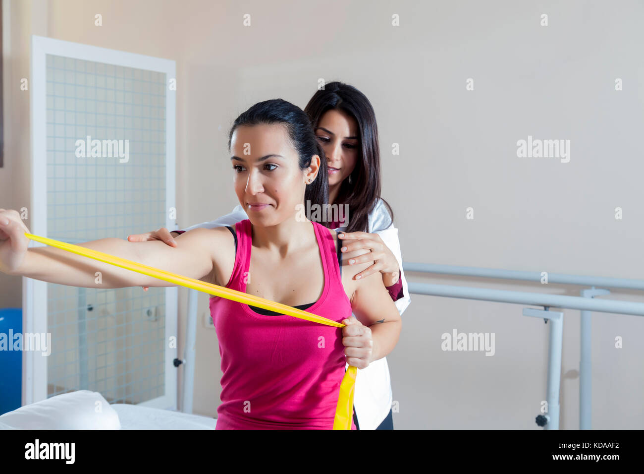 Patient doing some special exercises under supervision of physical ...
