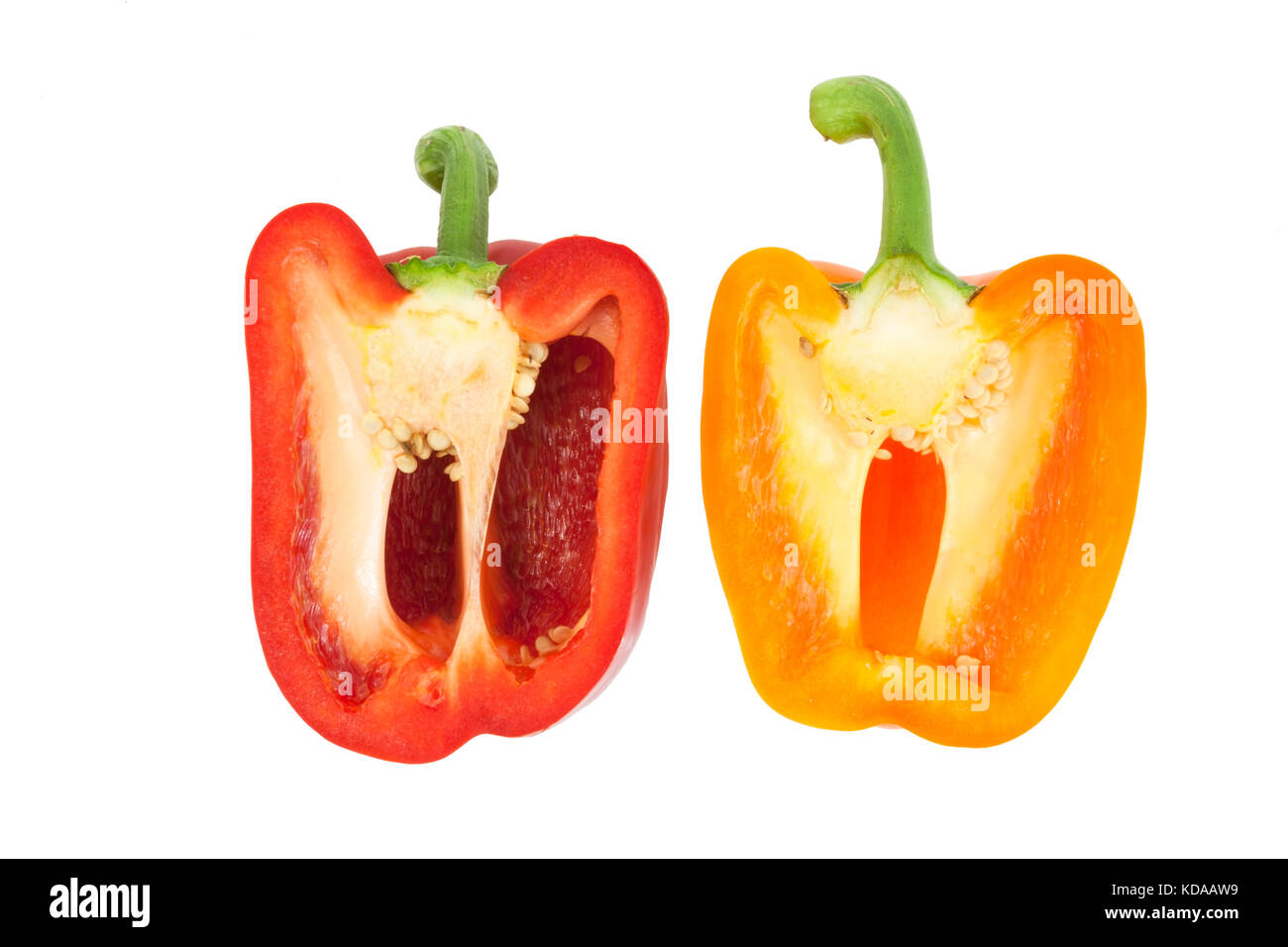 Red and orange bell pepper halves. Stock Photo