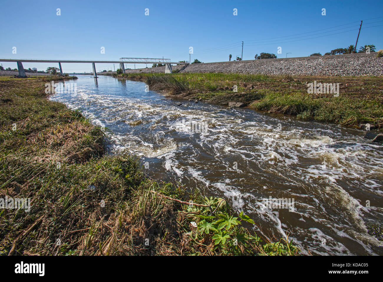 Trash strewn along Los Angeles River near WIllow Street, Long Beach