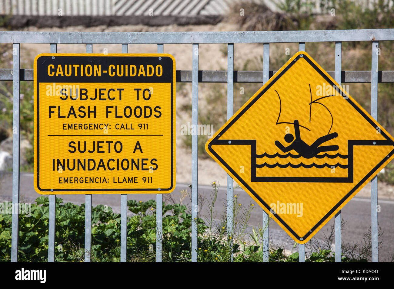Flash flood warning sign next to Los Angeles River, Long Beach, California, USA Stock Photo