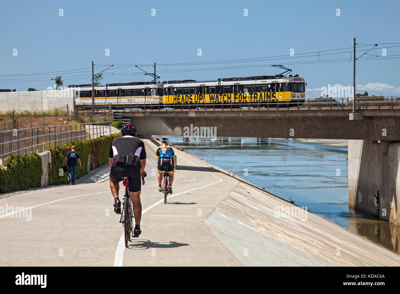 Los Angeles Metro Rail going over bike path along Los Angeles River, Long Beach, California, USA Stock Photo