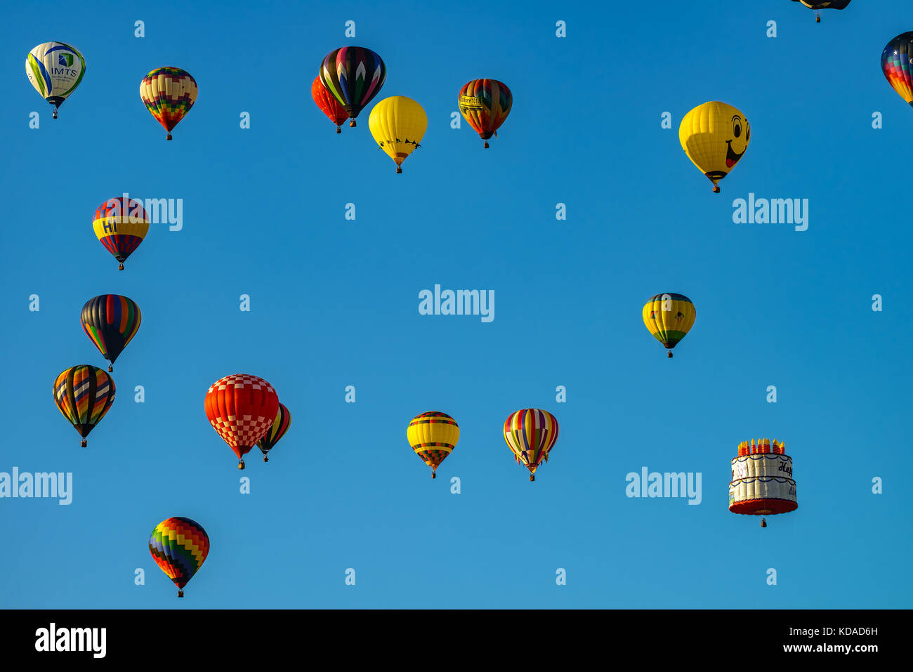 Colorful hot air balloons against blue sky Stock Photo - Alamy
