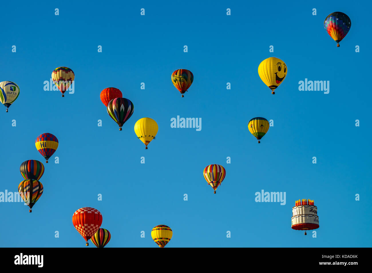 Colorful hot air balloons against blue sky Stock Photo - Alamy