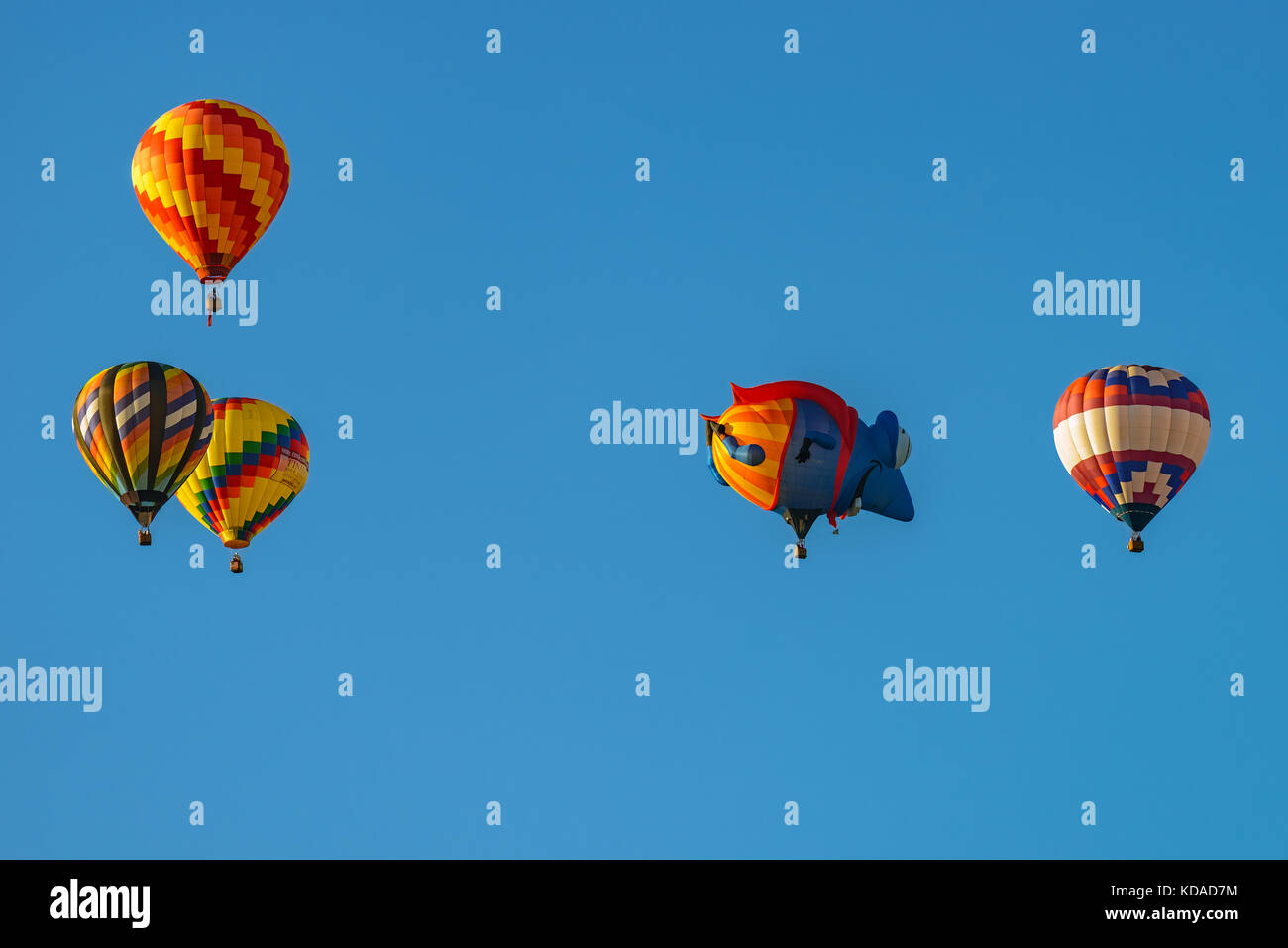 Colorful hot air balloons against blue sky Stock Photo - Alamy