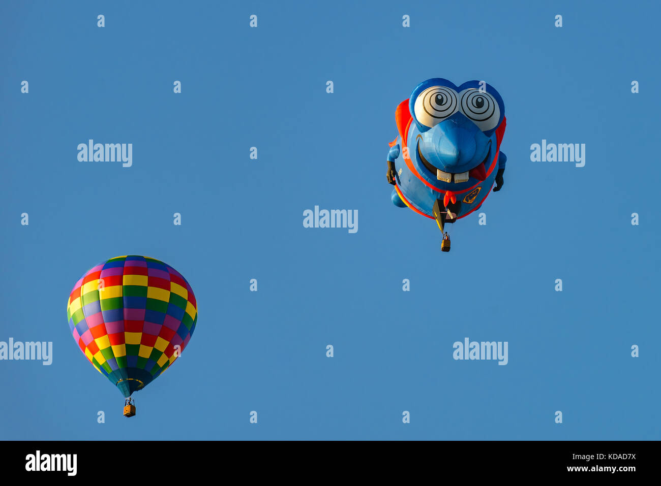 Colorful hot air balloons against blue sky Stock Photo - Alamy
