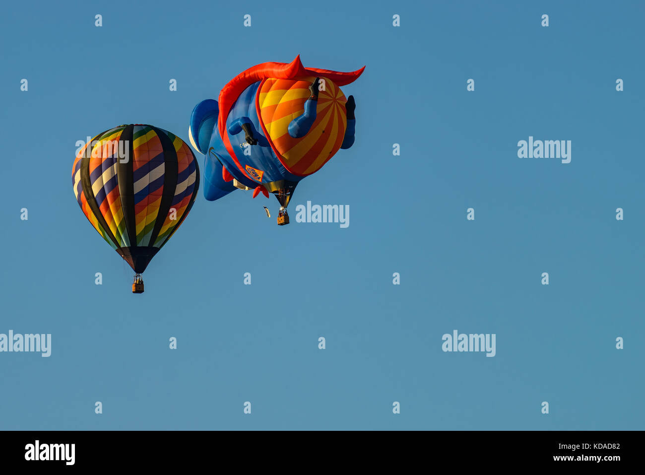 Colorful hot air balloons against blue sky Stock Photo - Alamy