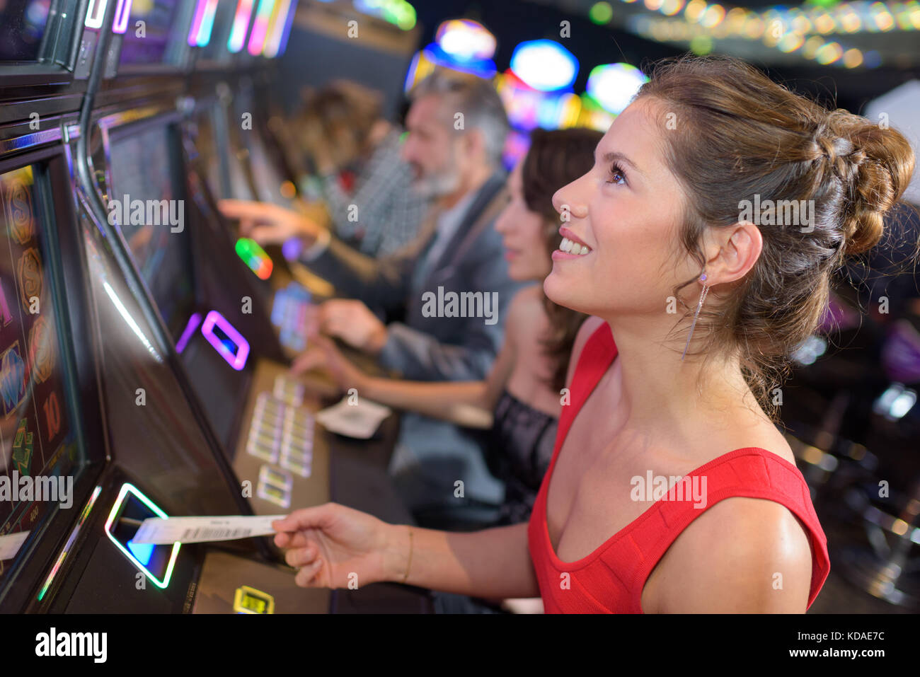 Man and woman playing gaming machine hi-res stock photography and ...