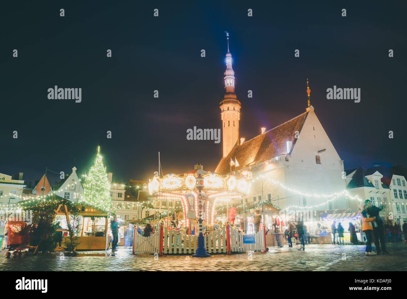 TALLINN, ESTONIA - NOVEMBER 20, 2016: Traditional christmas market in Tallinn old town. Locals and tourists enjoy winter holidays. Stock Photo