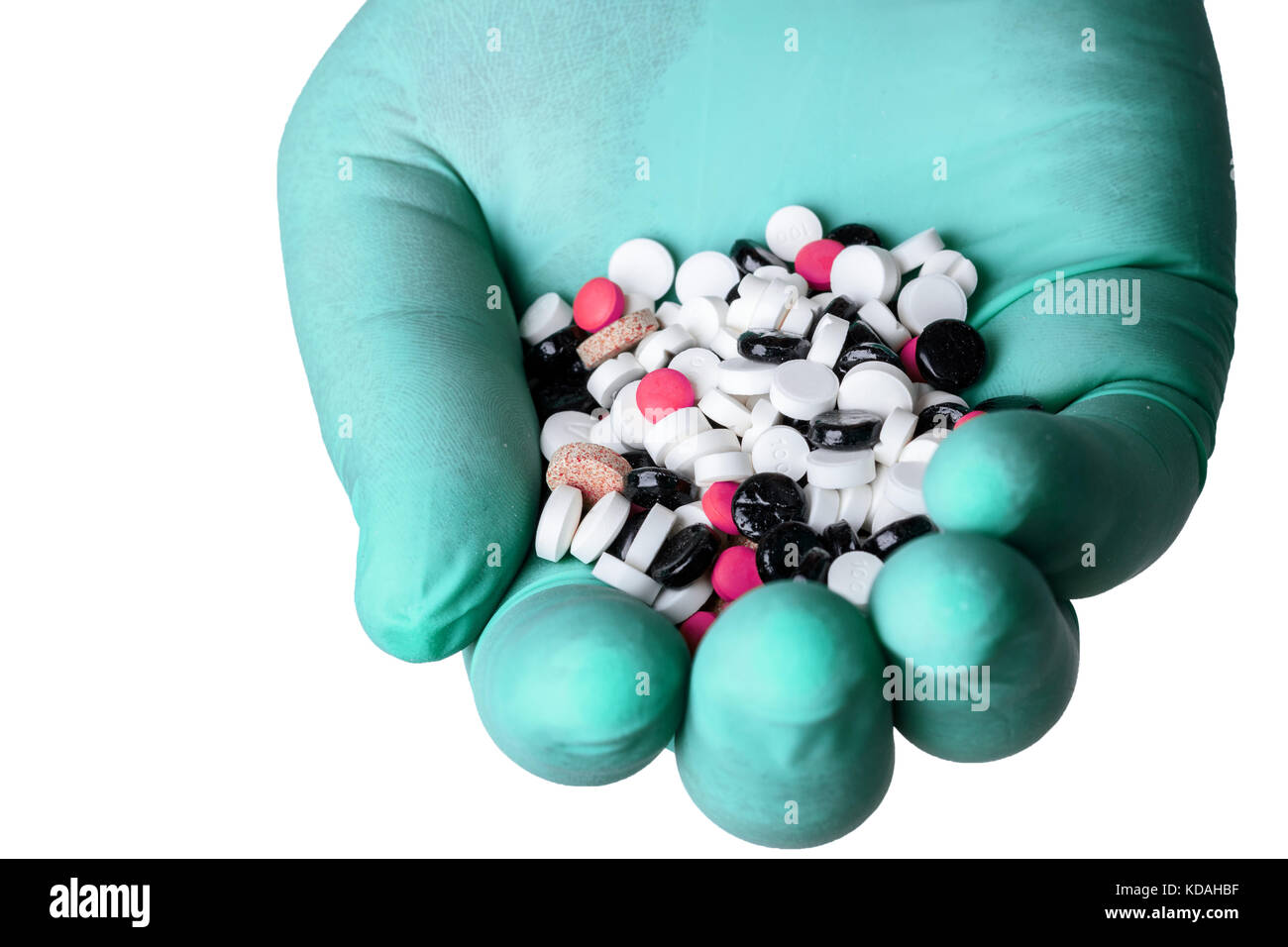 handful of pills in hand Stock Photo